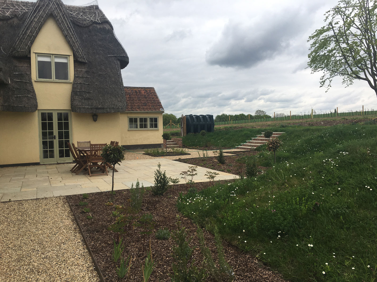 thatched cottage with a new patio offering views across the Essex countryside