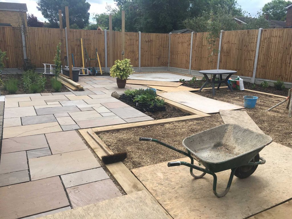 wide path leading through a garden to the site for a summerhouse