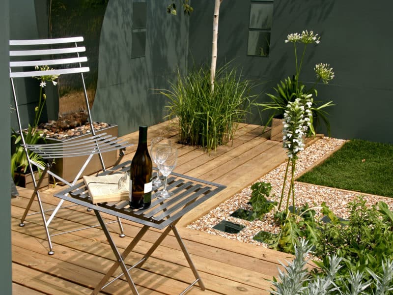 small garden with deck and seating