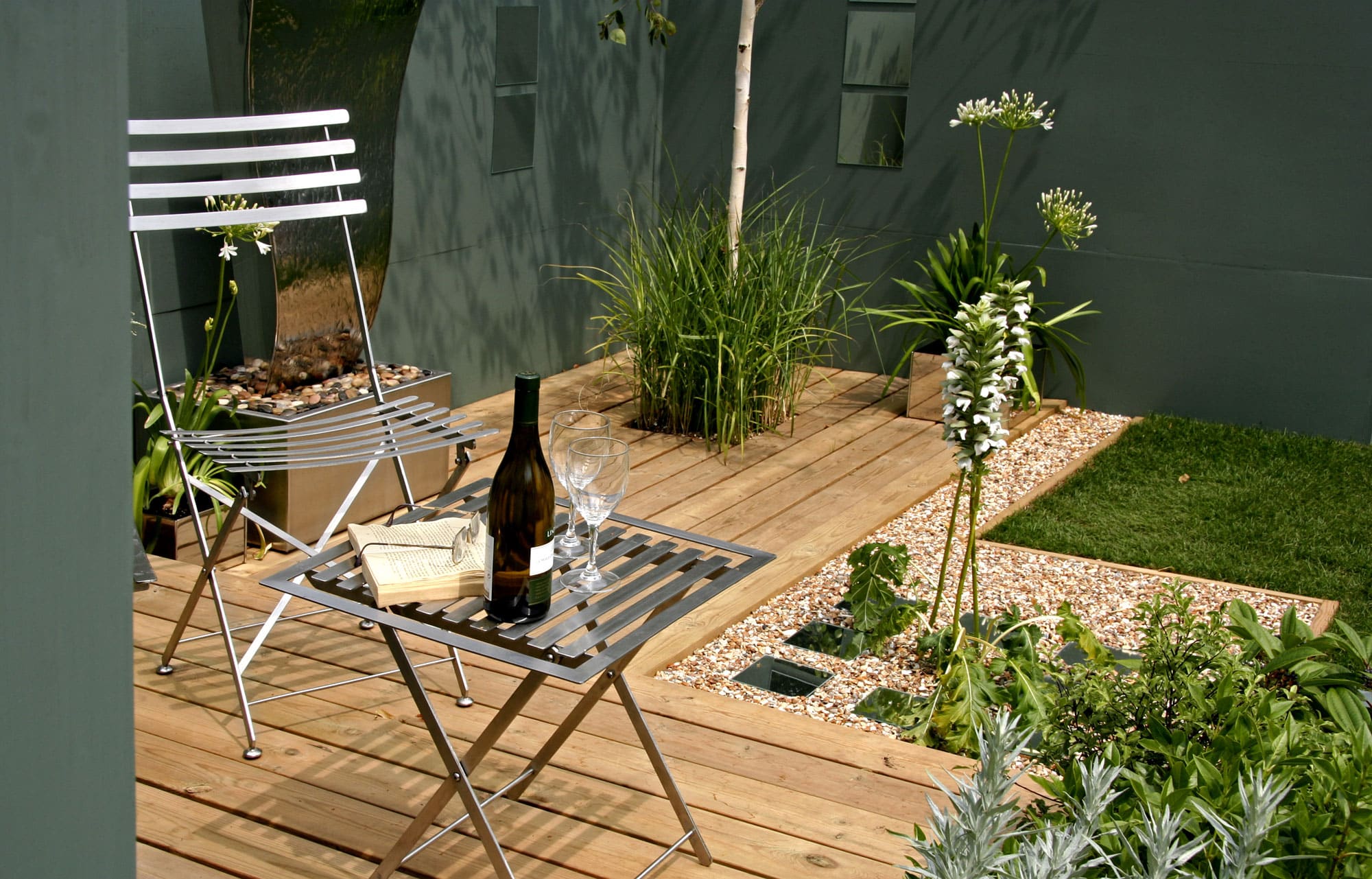 small garden with deck and seating