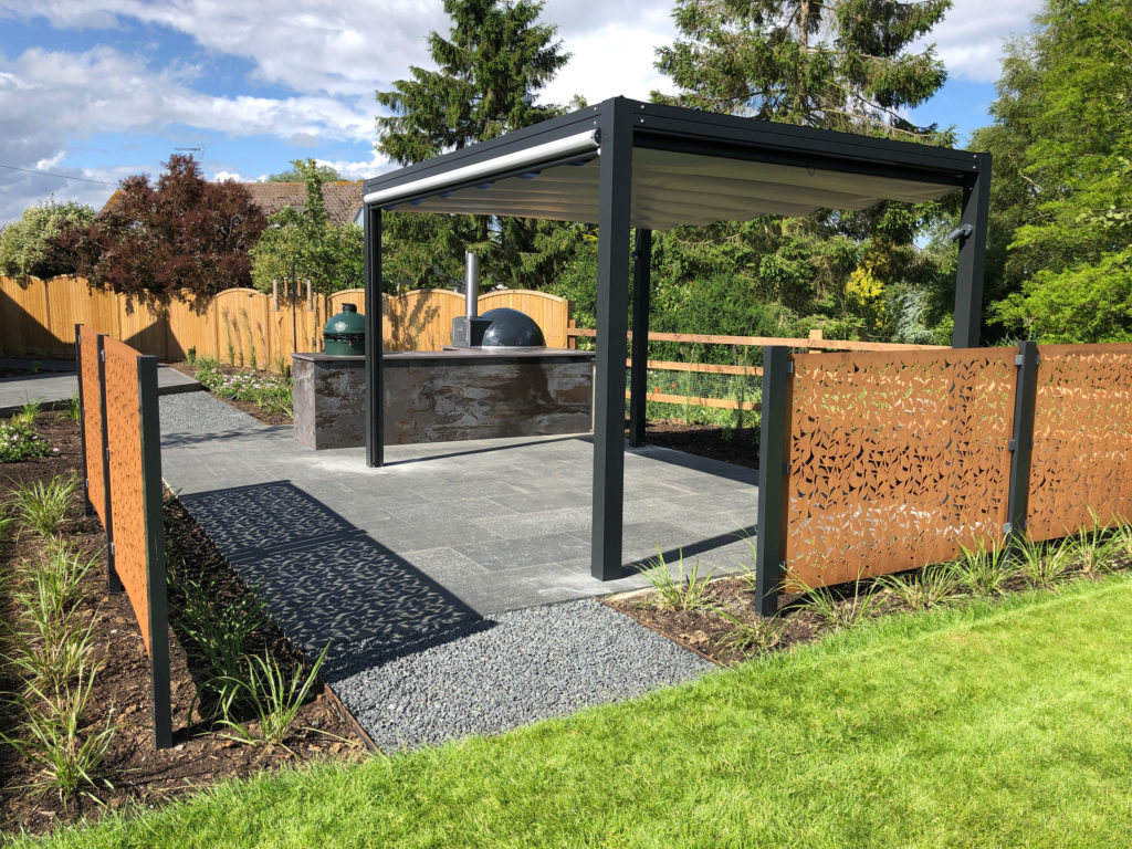 beautiful modern garden in Danbury with contemporary pergola, outdoor kitchen and corten steel screens