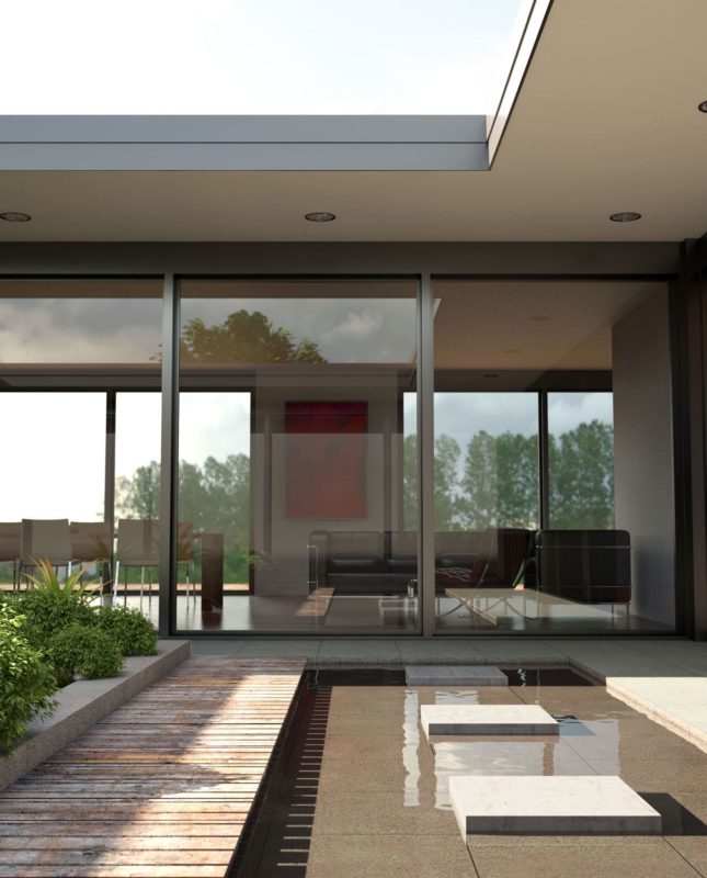 courtyard garden with shallow pool surrounded by bifold doors in modern building