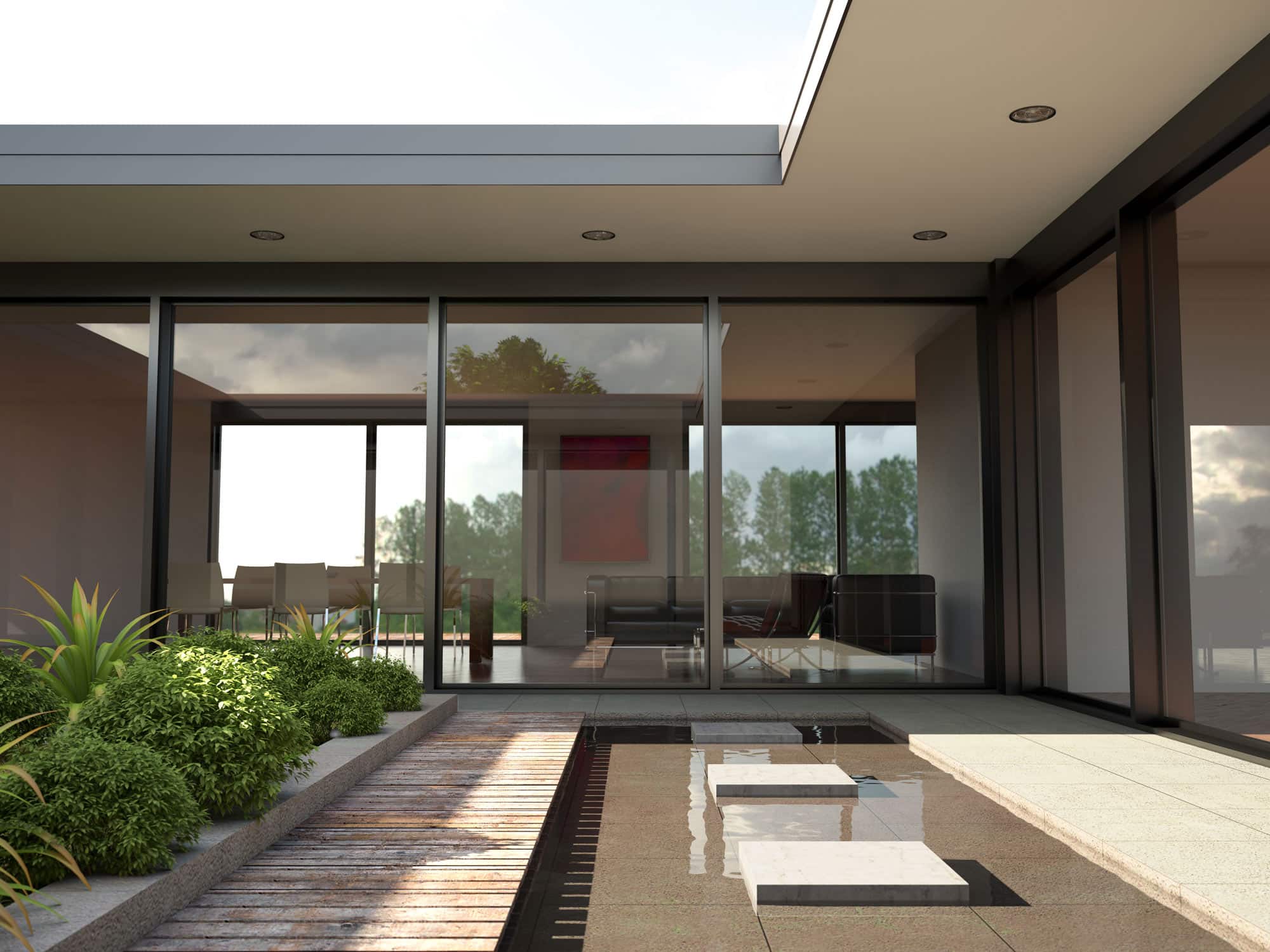 courtyard garden with shallow pool surrounded by bifold doors in modern building