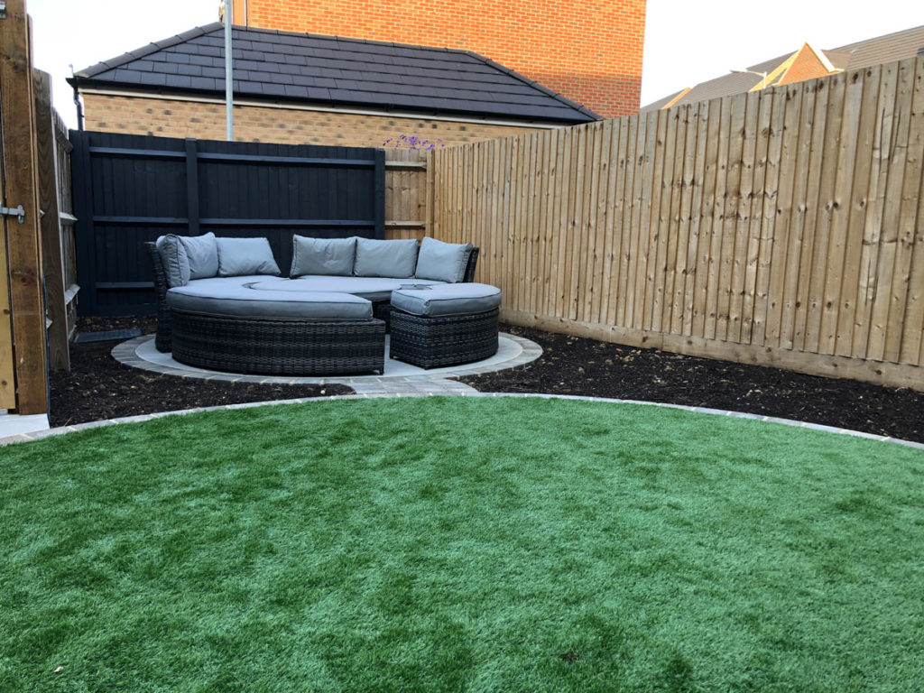 seating area and circular artificial grass lawn