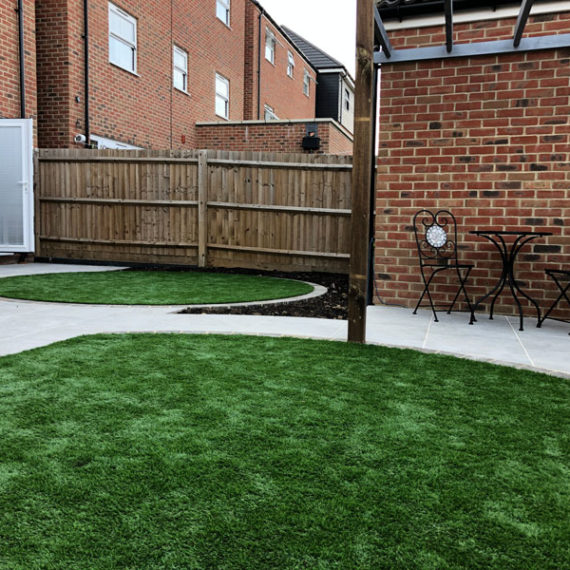 modern back garden with artificial grass lawns