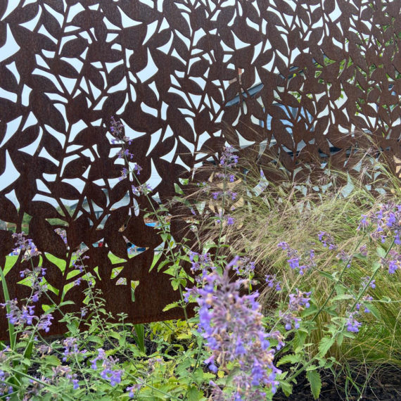 corten metal garden screen with leaf design