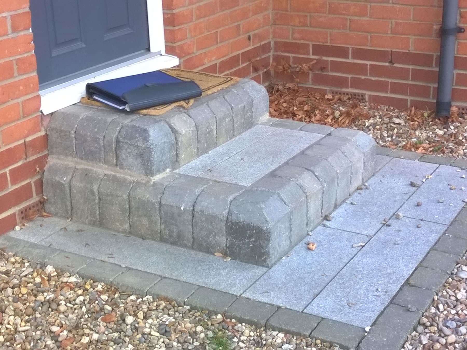 narrow front door step with two risers