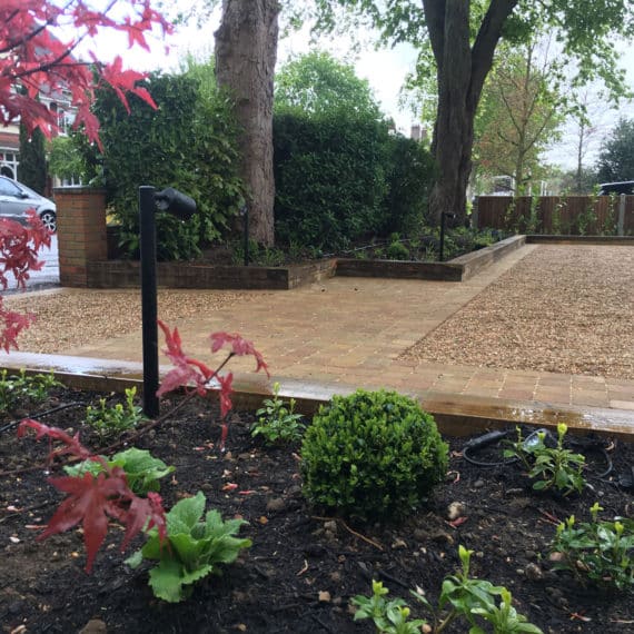 pretty shade tolerant planting plan in front driveway