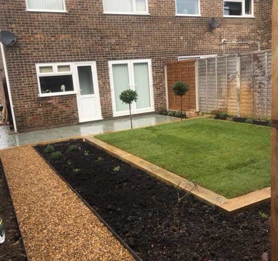 lawn, planting beds and gravel path in contemporary back garden