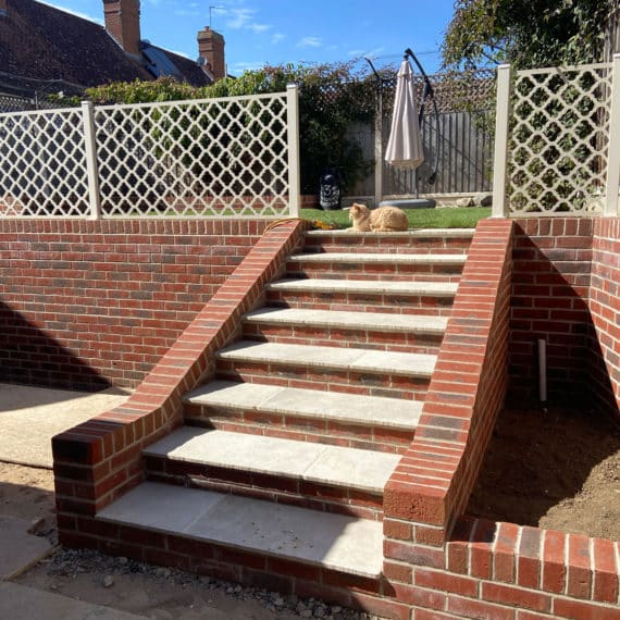 Sturfy garden steps with brick built walls and risers and cream coloured step treads