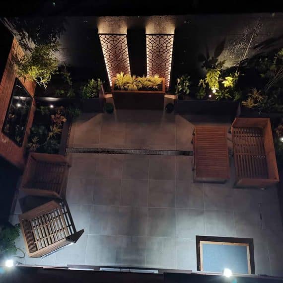 paved garden with stylish lighting