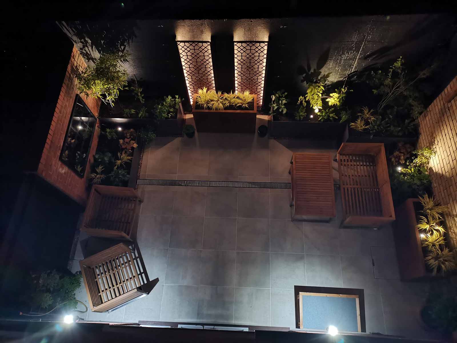 paved garden with stylish lighting