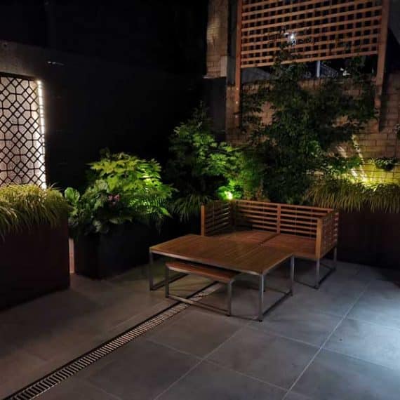 modern courtyard garden with soft evening lighting