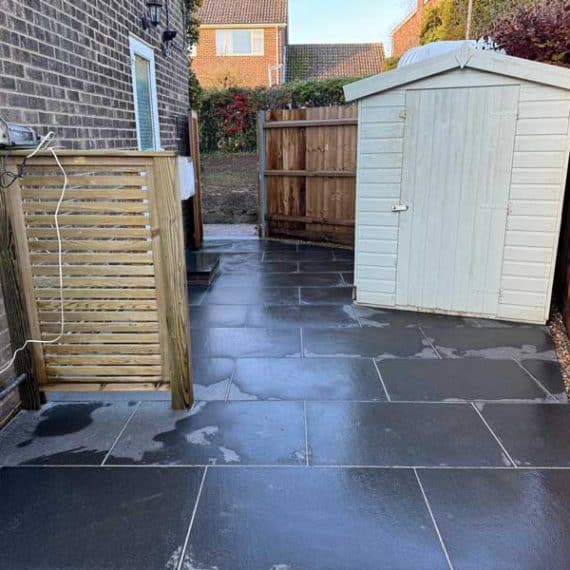 garden utility area with shed and bin store