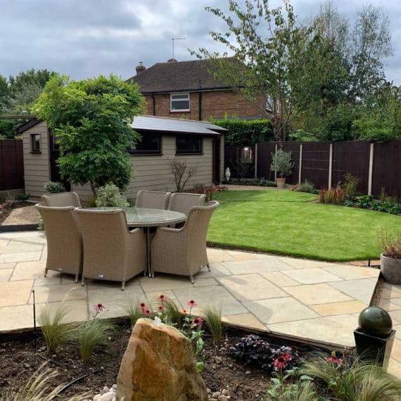 well appointed patio with views towards garden workshop